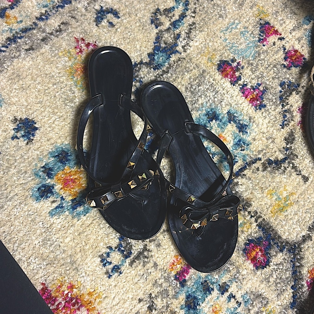 Black flip flops with gold studs